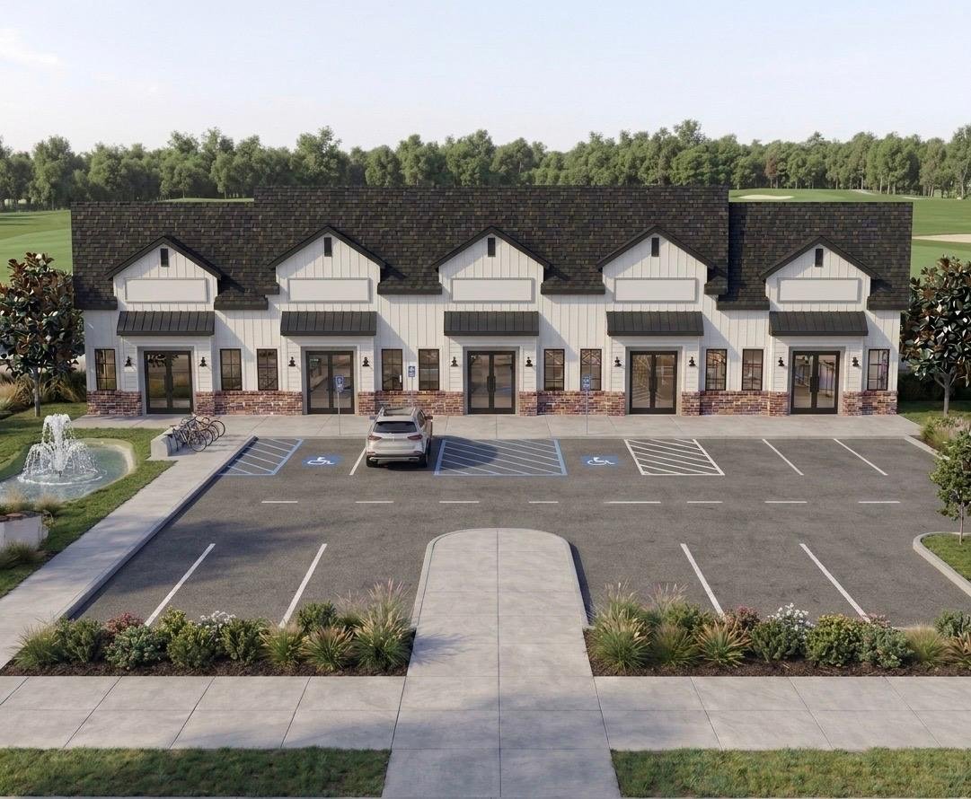 Architectural rendering of The Village on Canton, a five-suite commercial plaza with white siding, stone accents, dark gabled roof, and landscaped parking